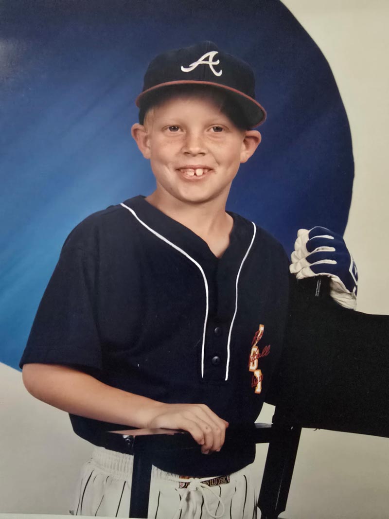 Young Cody Barrs Baseball Player in Navy