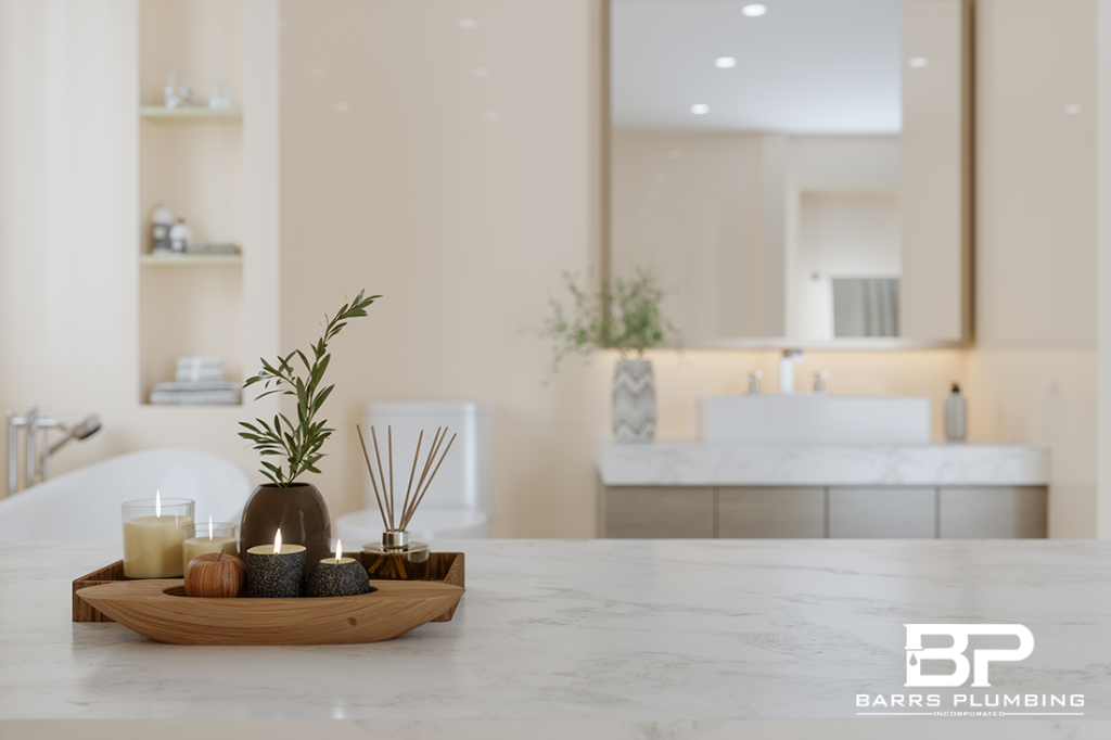 Close-up View Of White Marble Countertop With Candles And Blurred Bathroom Background